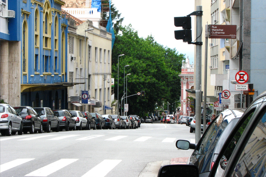 City street in Florianópolis, Brazil, illustrating local transport infrastructure, road networks, public transportation, and daily commuting options.